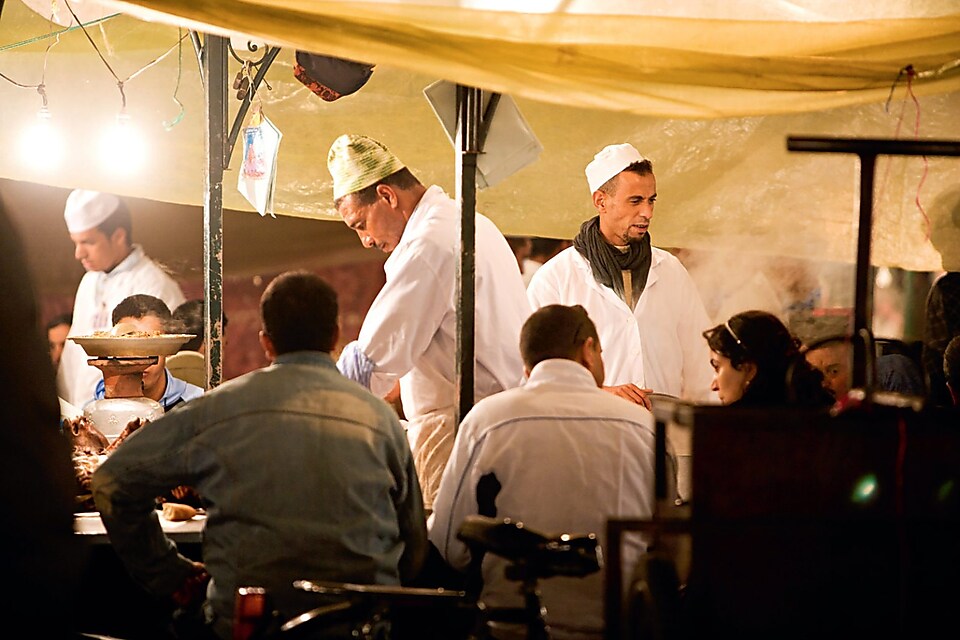 Chef serving people delicious food