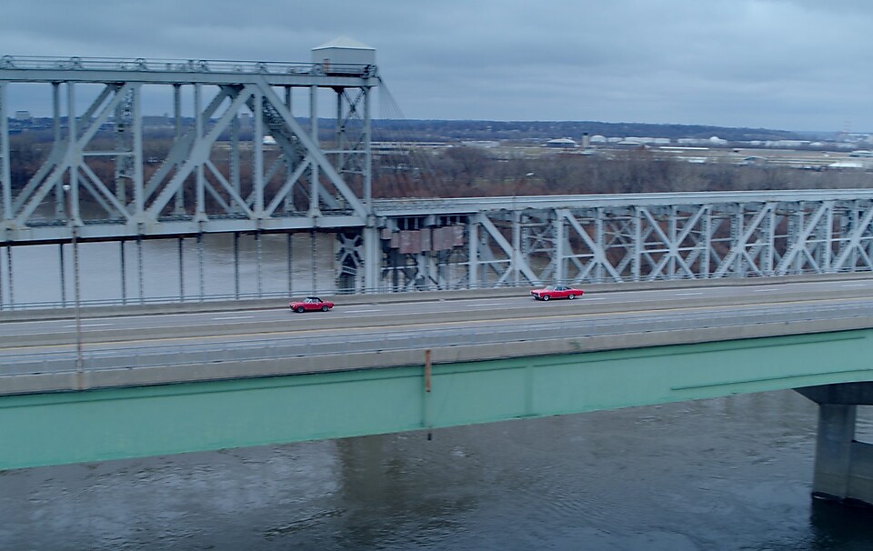Red car on the bridge